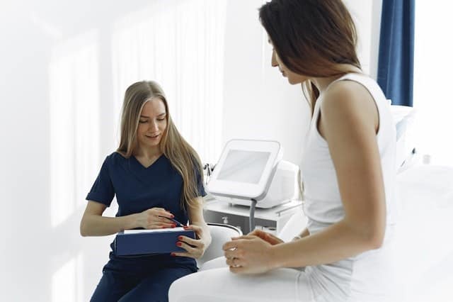 woman talking to doctor