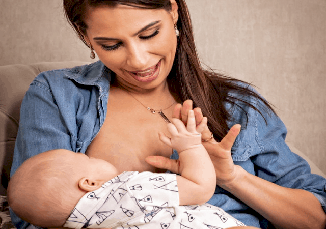 mom playing with baby