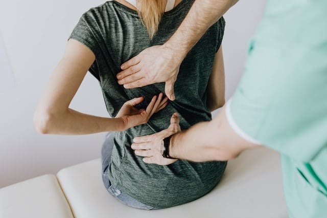 woman back pain therapy