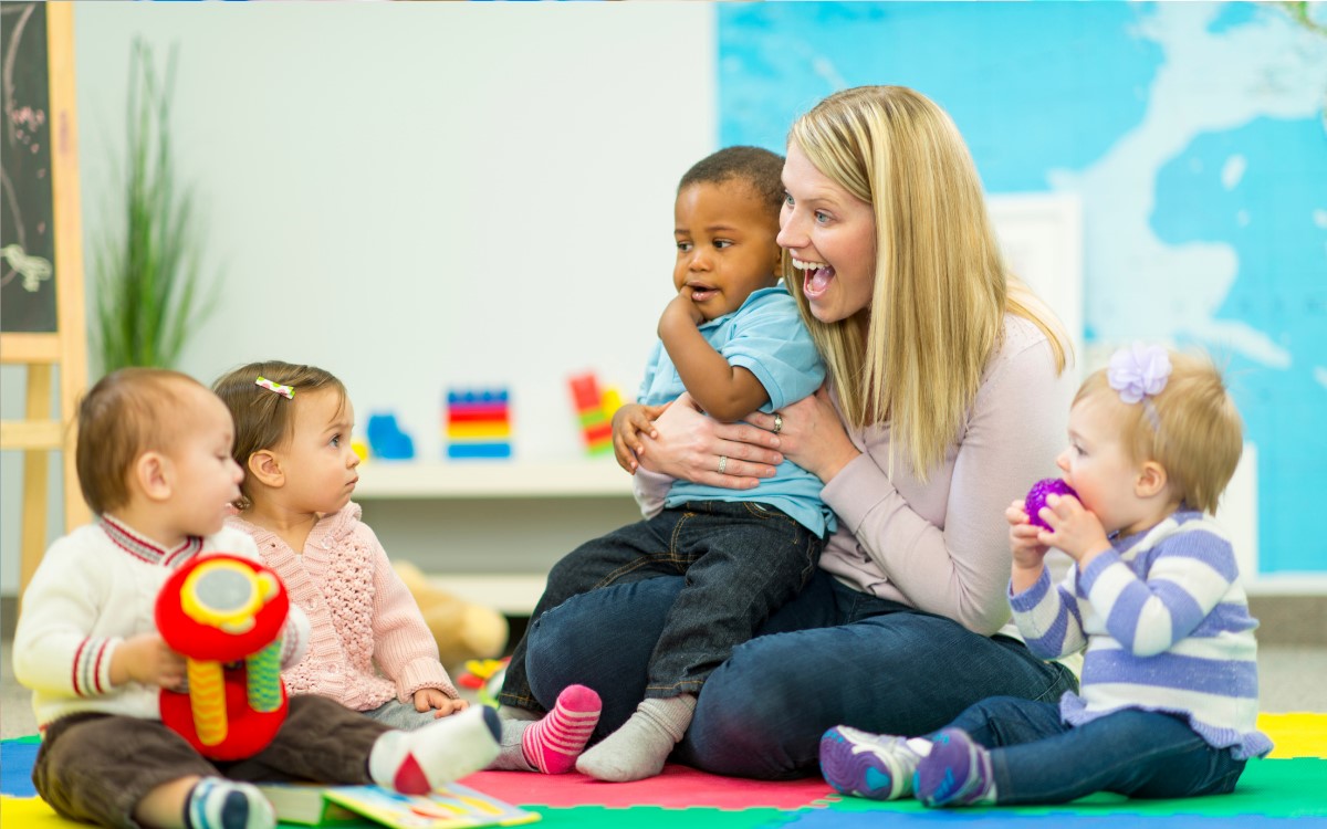 daycare woman holding a baby