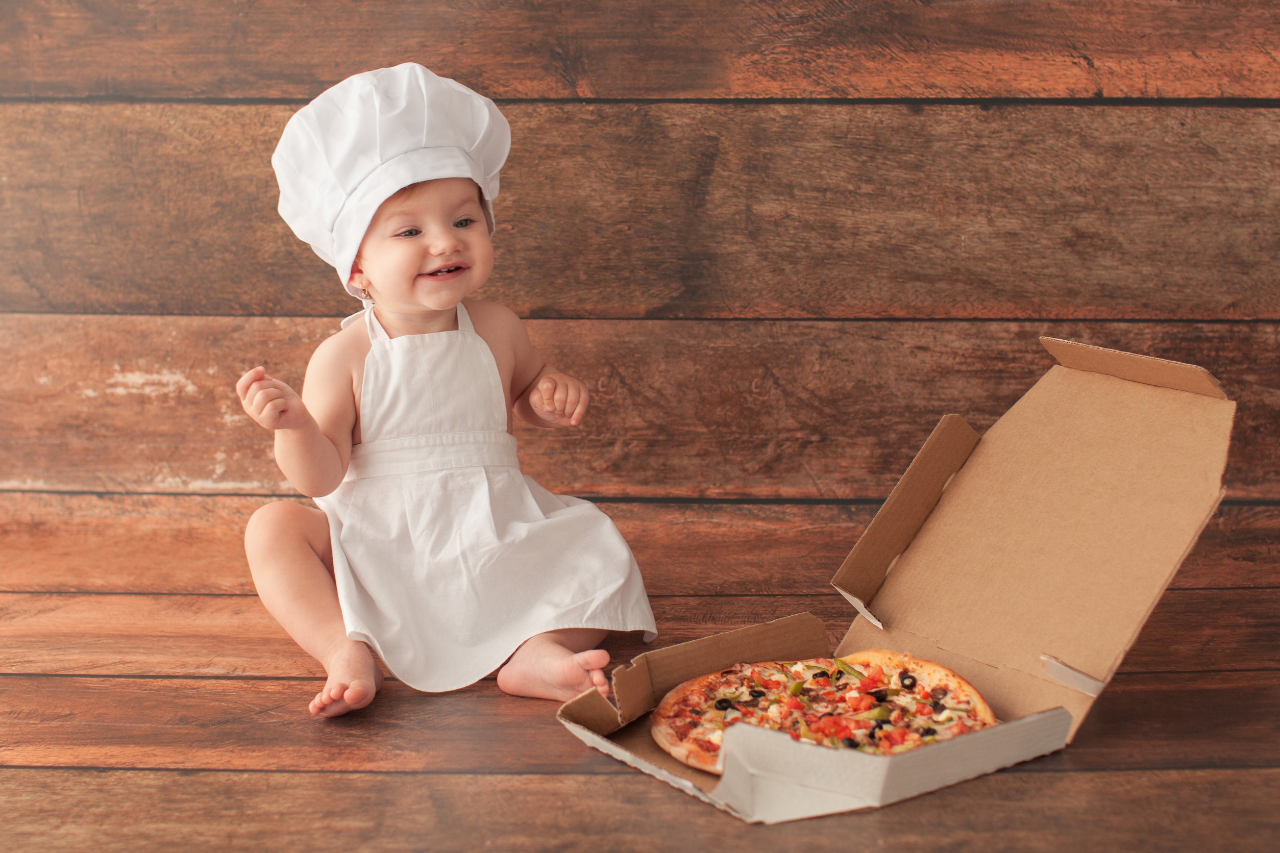 baby with pizza