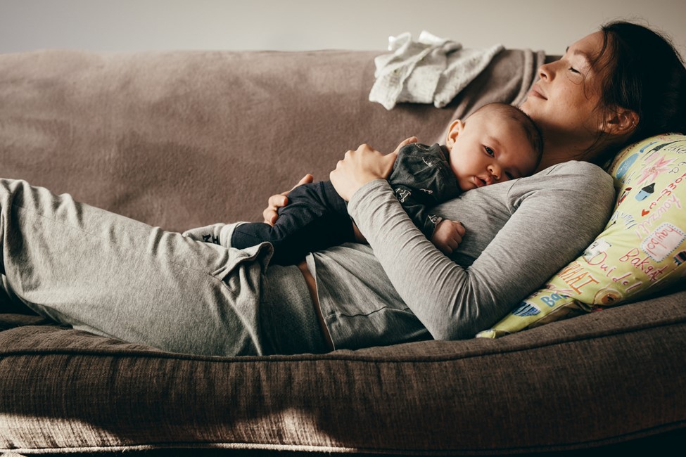 baby sleeping on mom