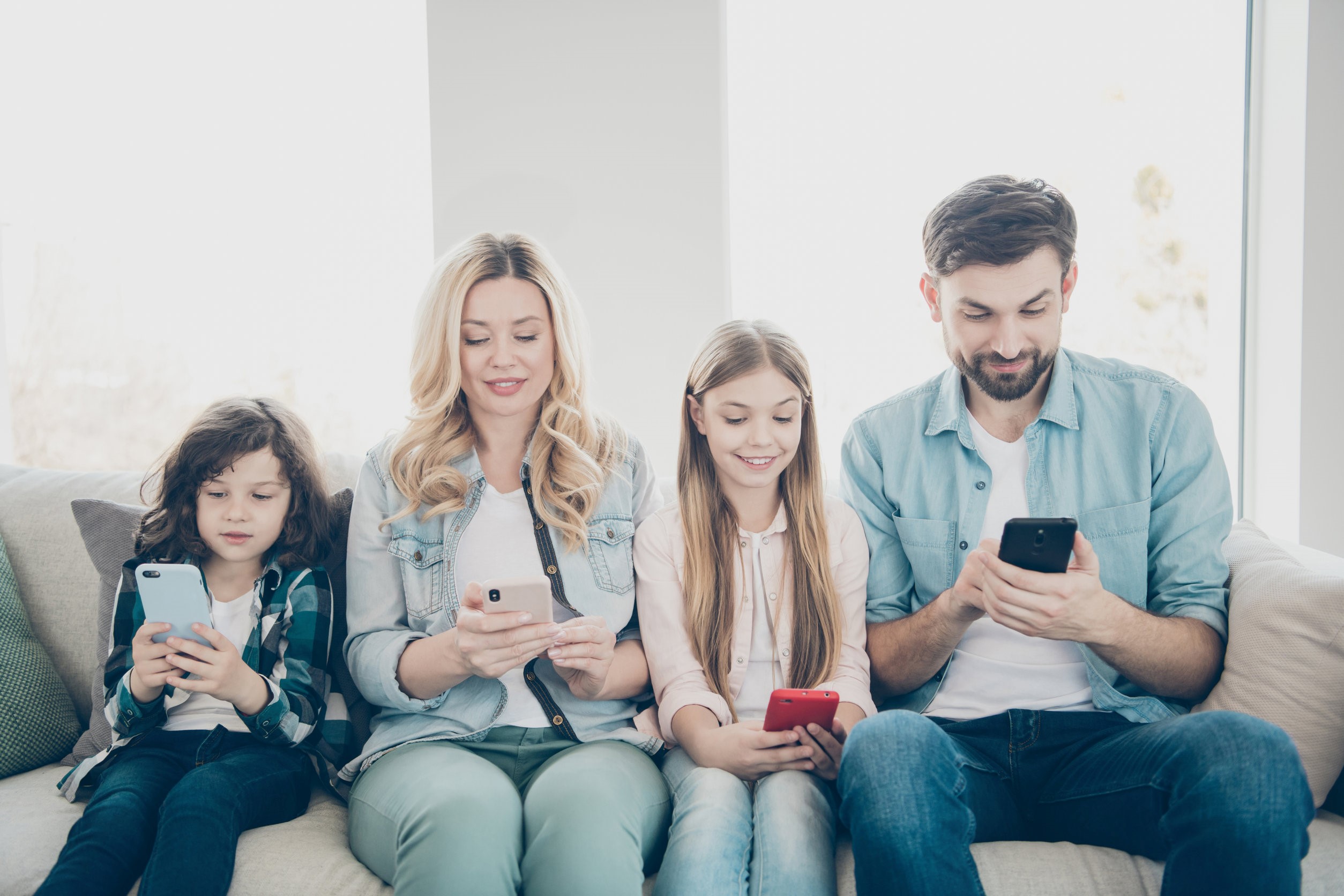 family using phones