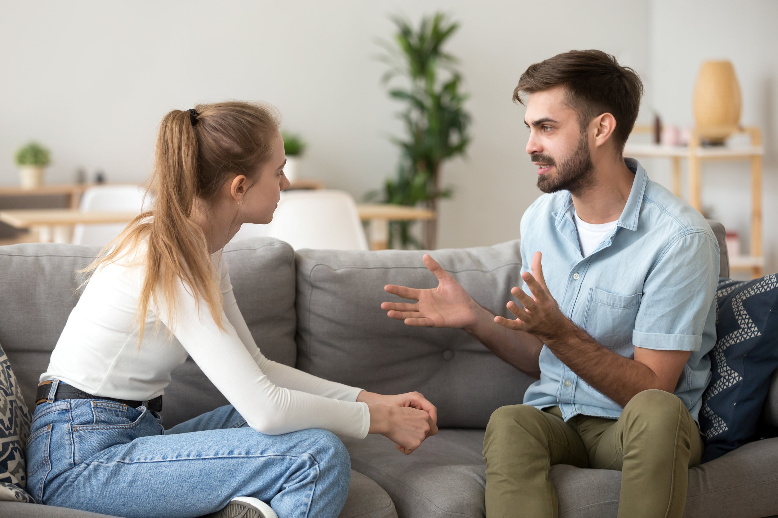 man explaining to woman