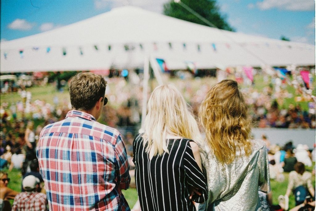 3 friends standing in an event