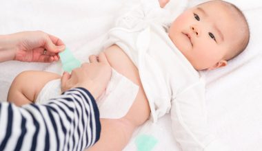baby getting her diaper changed