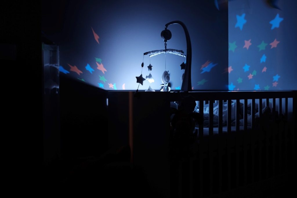 baby's crib with star projector