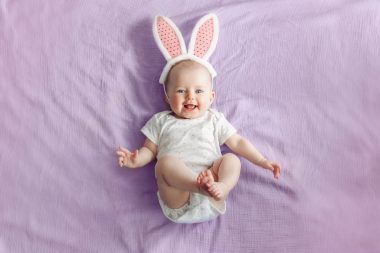 cute baby wearing onesies and bunny headband