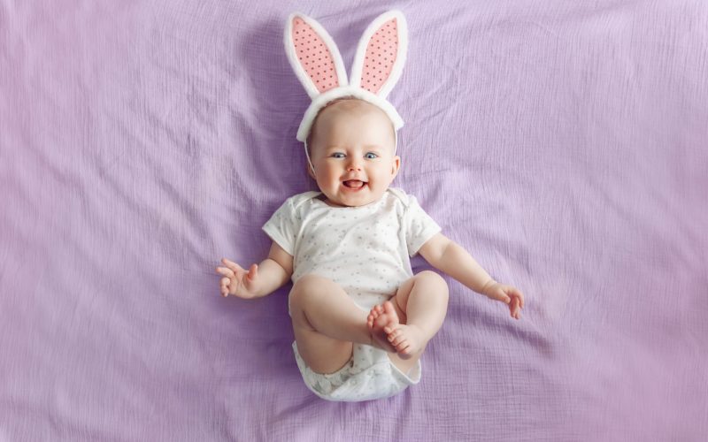 cute baby wearing onesies and bunny headband