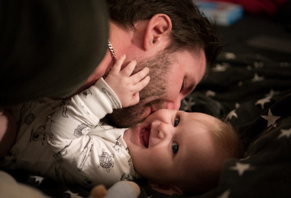 dad kissing baby