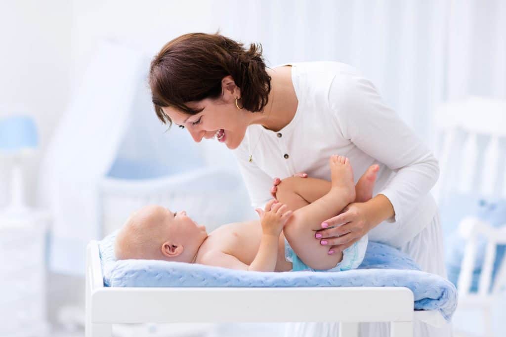 mom and baby laughing at each other