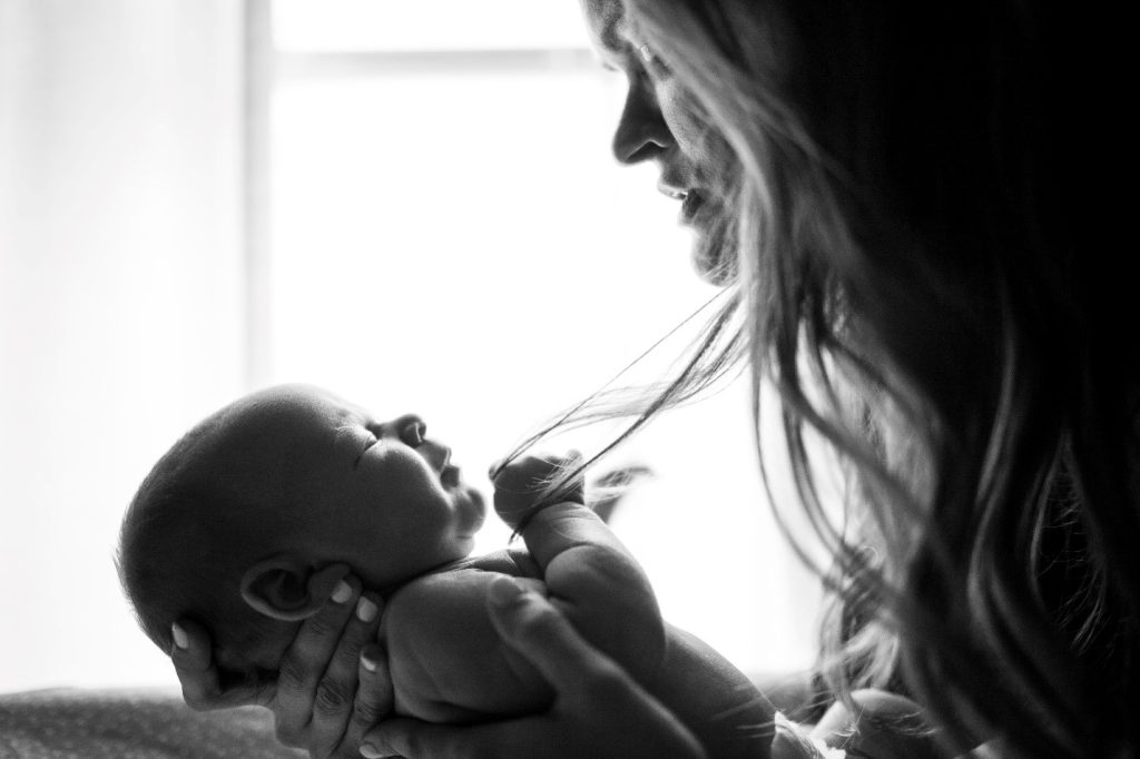 mom holding her baby