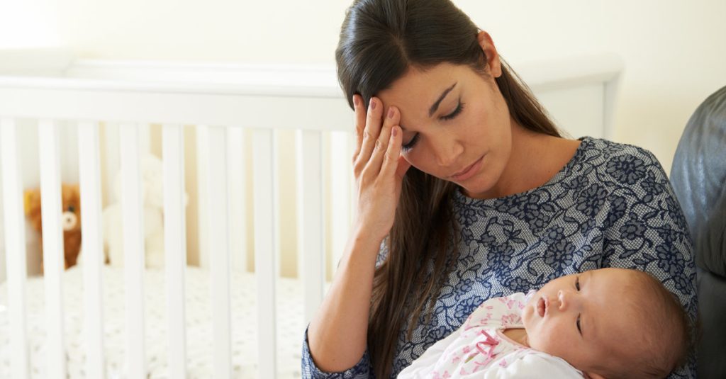 mother and baby looking tired