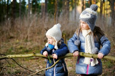 toddlers hiking on the forest