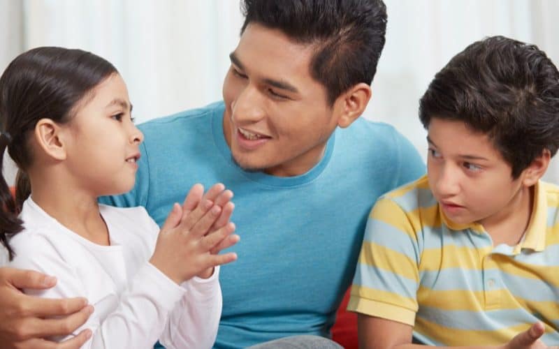 dad talking to his children