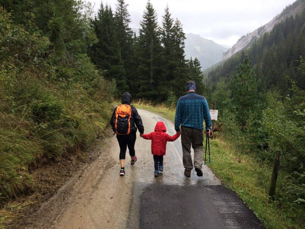 family walking on a forest