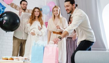 friends having fun during gender reveal party