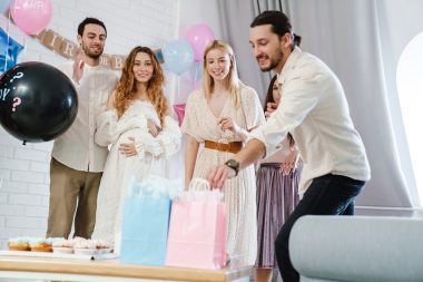 friends having fun during gender reveal party