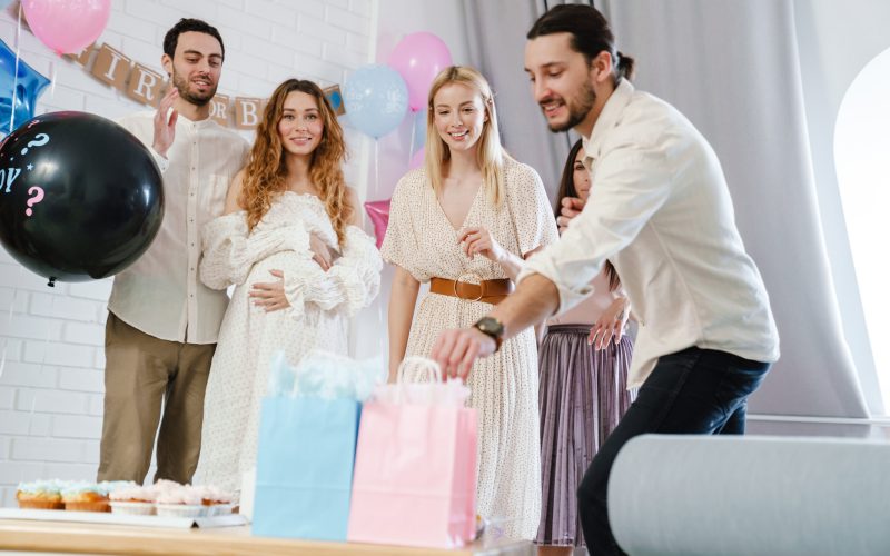 friends having fun during gender reveal party