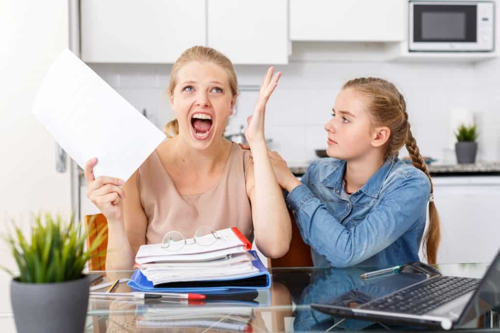 girl trying to calm her screaming mother