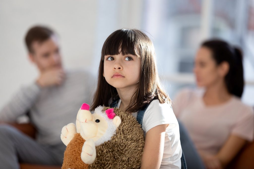 little girl feeling neglected by parents
