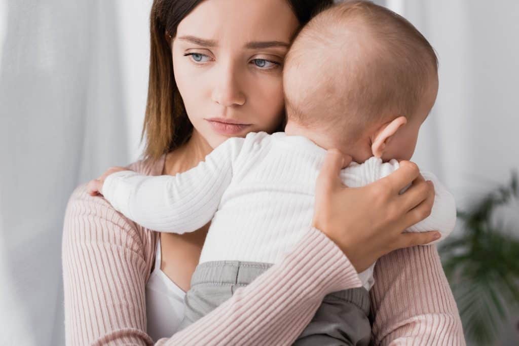 woman holding her baby