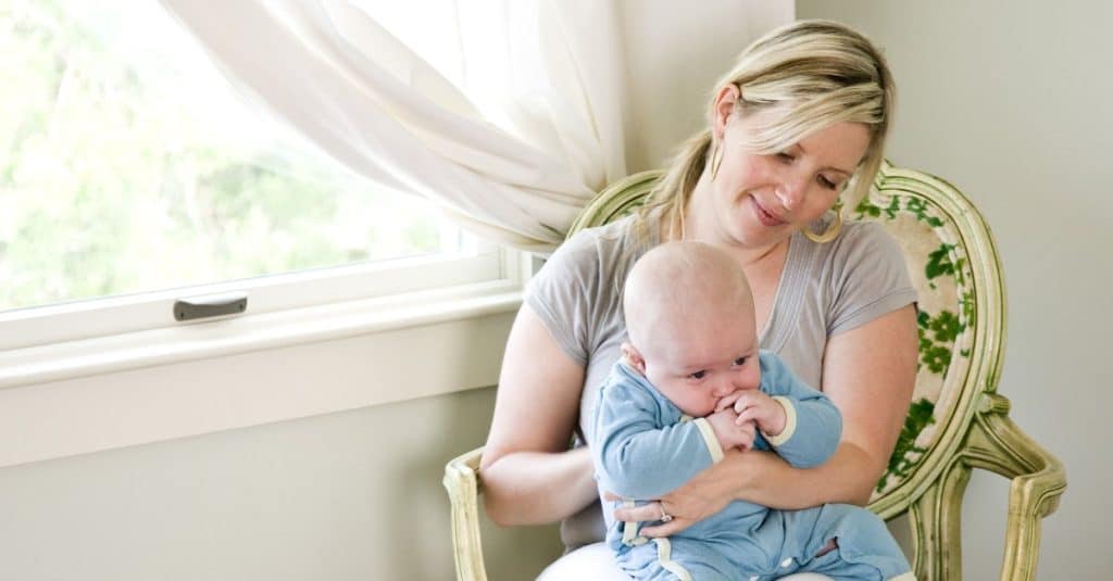 burping baby while sitting on lap