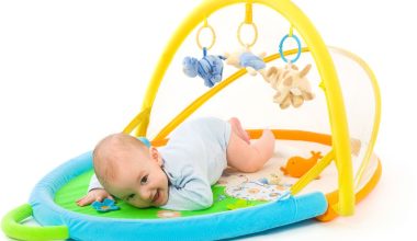 cute baby in his gym toy