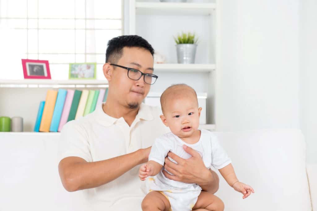 dad carrying baby