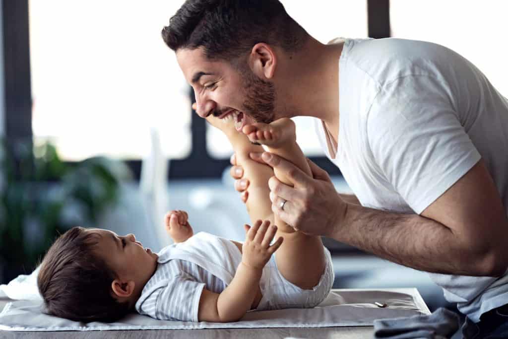 dad entertaining baby