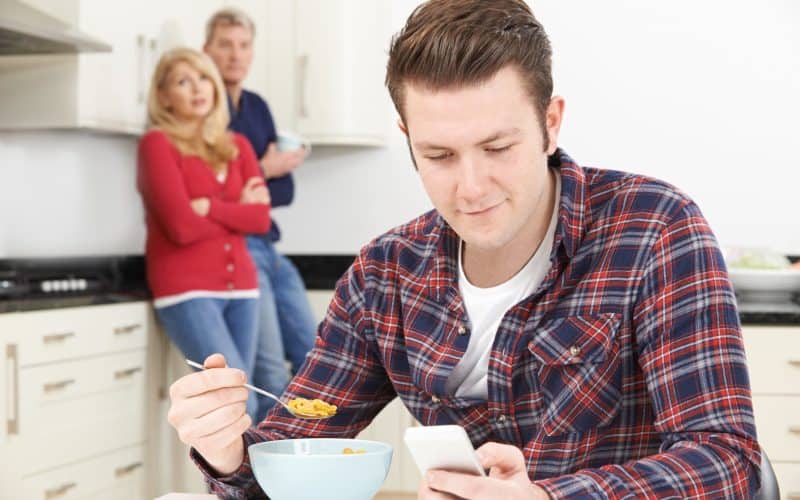 frustrated parents while son texting