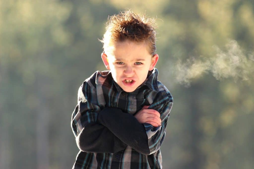 little boy with arms crossed