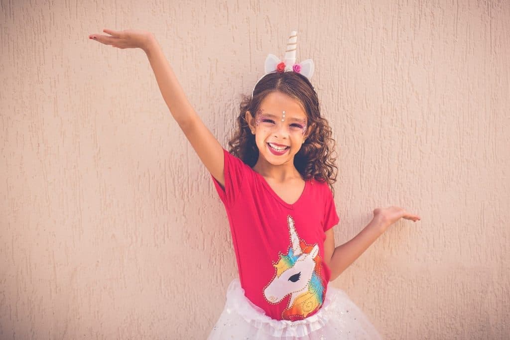 little girl in unicorn attire