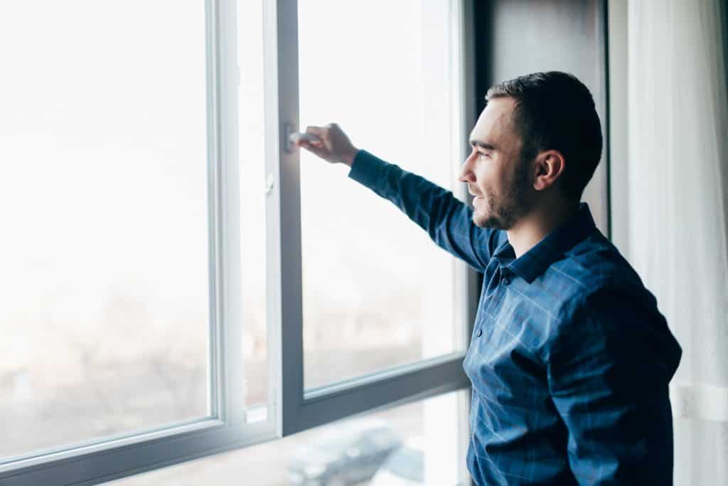 man opening the window