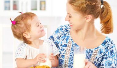 mother and daughter drinking milk