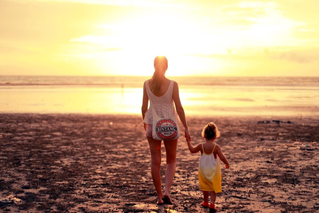 mother and little girl at the beach