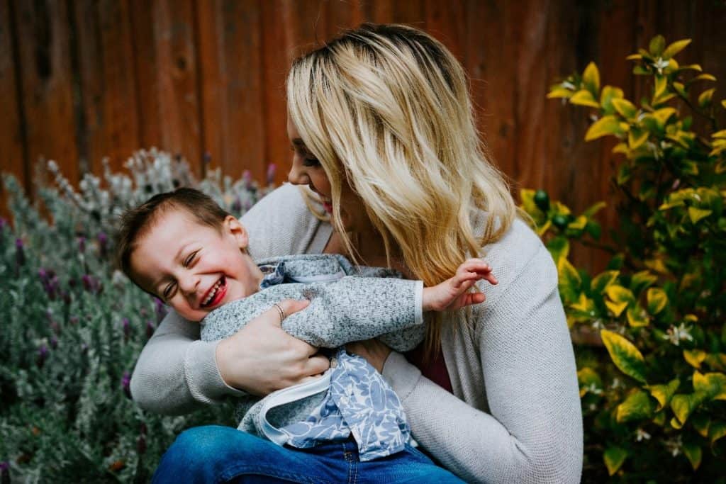 mother laughing with her baby