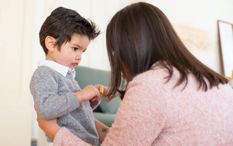 toddler looking at his mom