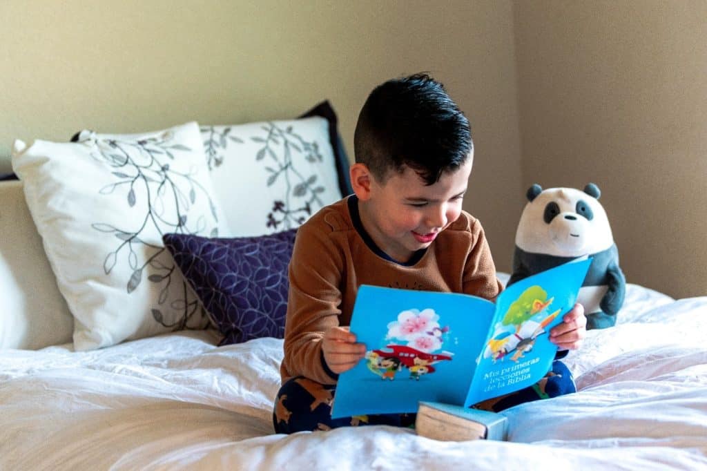 toddler reading a children's book