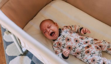 baby crying on a crib