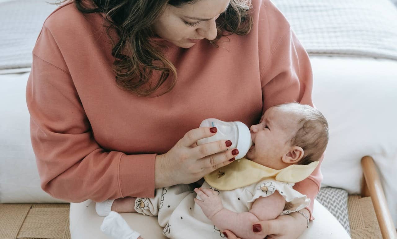 Baby Clicking While Bottle Feeding? Reasons & How to Fix It