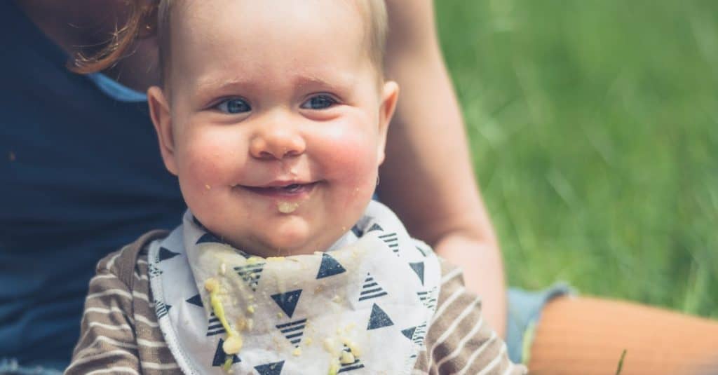 cute baby with food on face