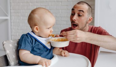 dad feeding baby