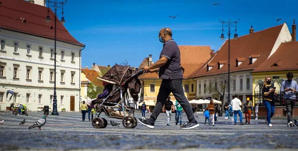 dad strolling baby