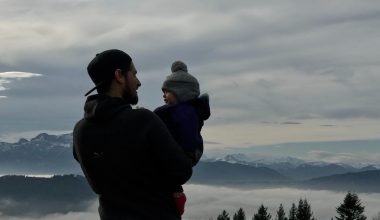 dad talking to baby while outdoors