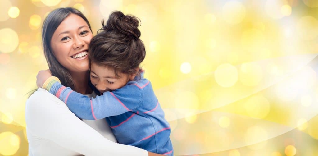 daughter hugging her mom