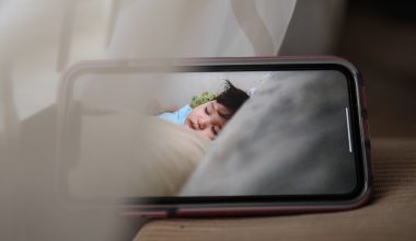 mobile phone with sleeping baby