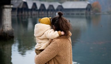 mom and baby looking at the lake