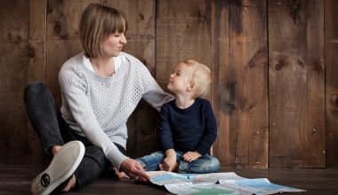 mom and her little boy holding a map