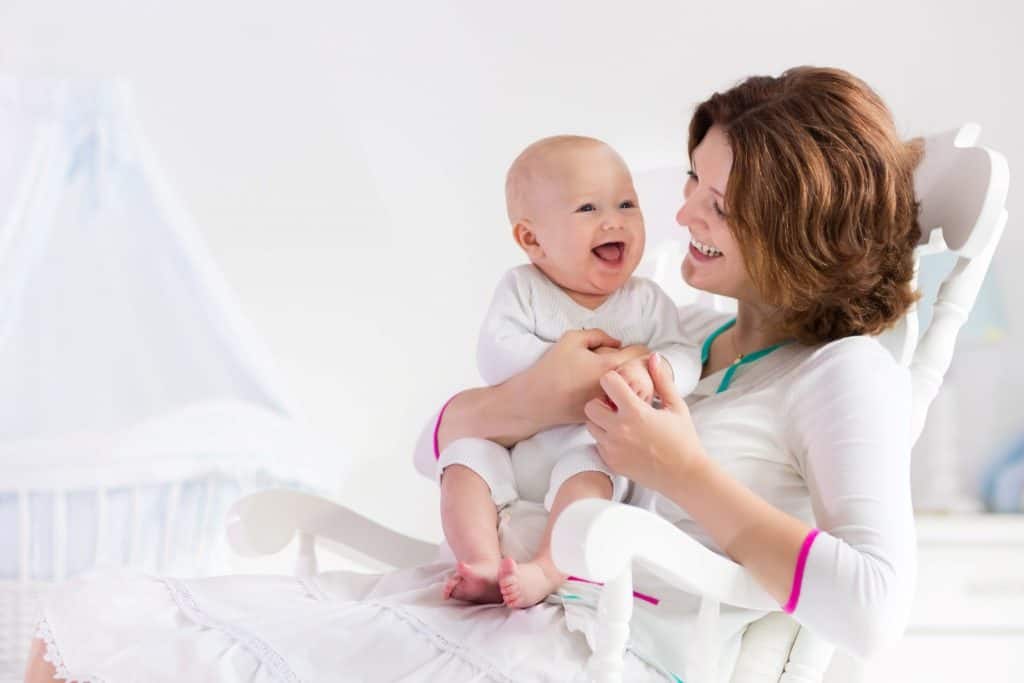 mom laughing with baby boy